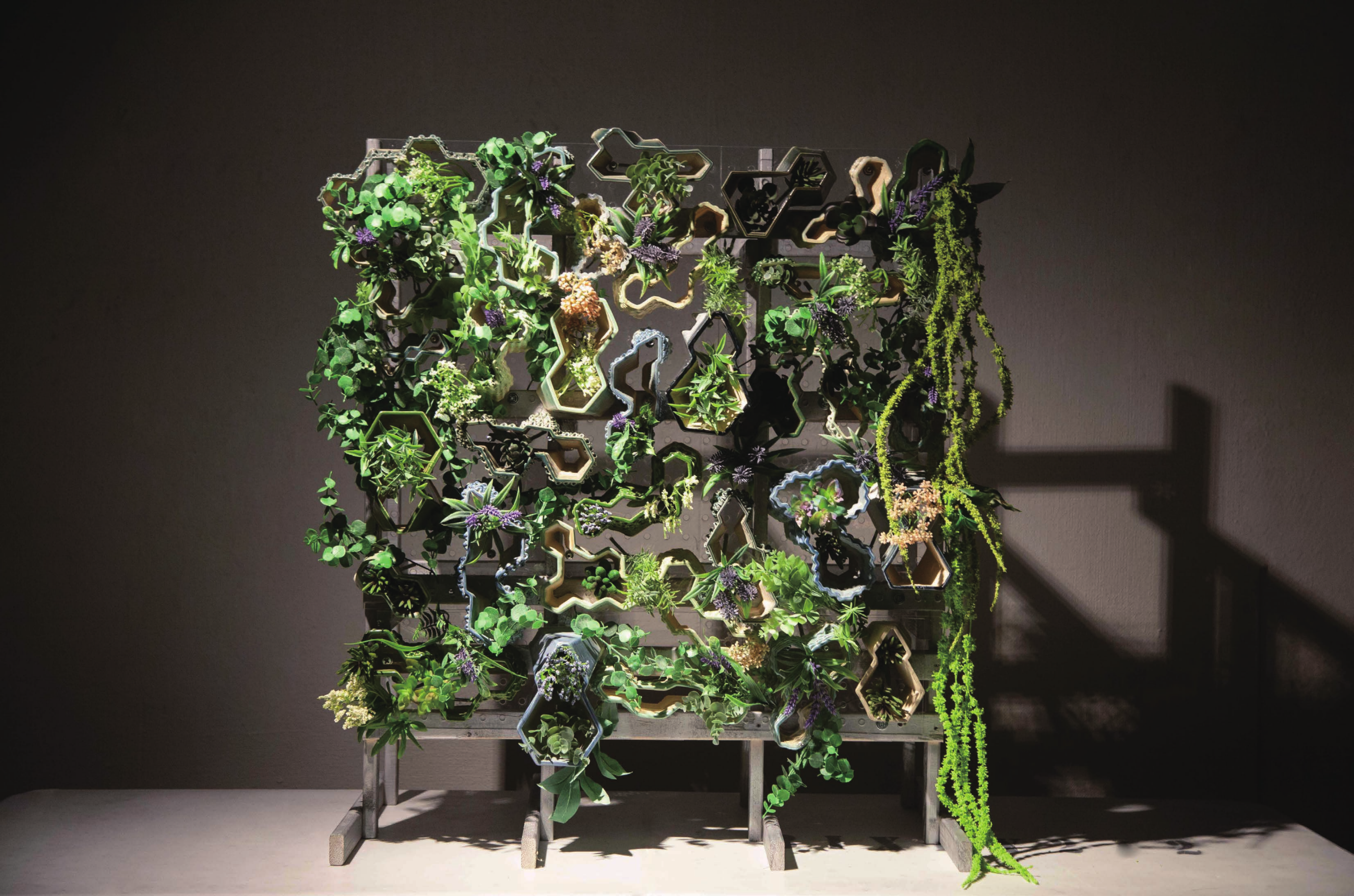 Illuminated physical model of a planted vertical facade system